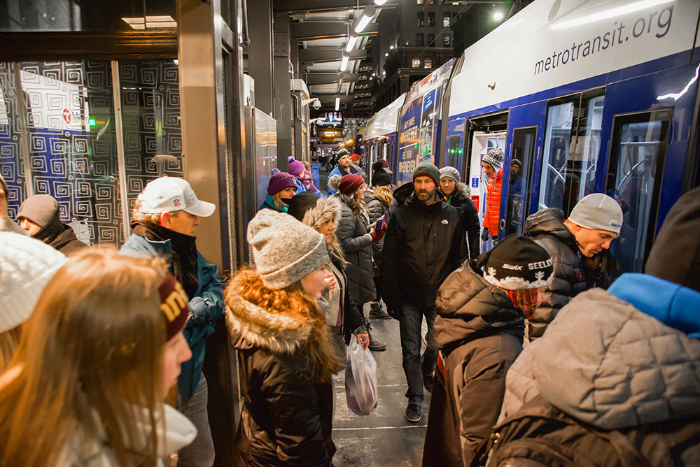 Customers board a Metro Transit light rail vehicle at the Nicollet Mall Station in 2018.
